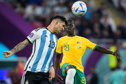 Cristian Romero of Argentina and Garang Kuol of Australia