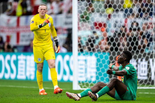 Goalkeeper Jordan Pickford of England and Ismaila Sarr of