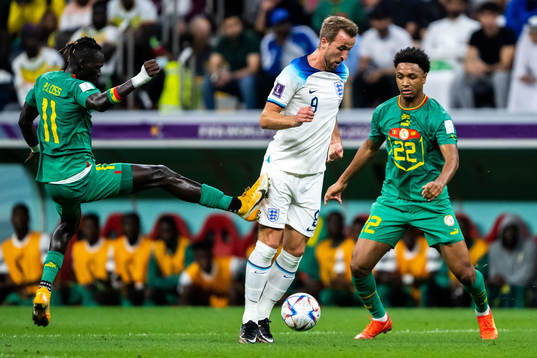Pathe Ciss and Abdou Diallo of Senegal and Harry Kane of