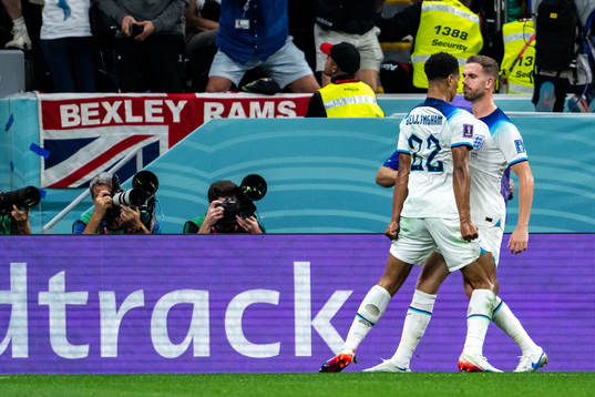 Jude Bellingham and Jordan Henderson of England celebrate