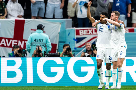 Jude Bellingham and Jordan Henderson of England celebrate
