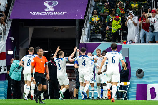 Harry Kane of England celebrates scoring 2-0 with teammates