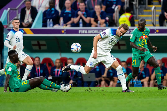 Pape Gueye and Youssouf Sabaly of Senegal and Harry Kane of