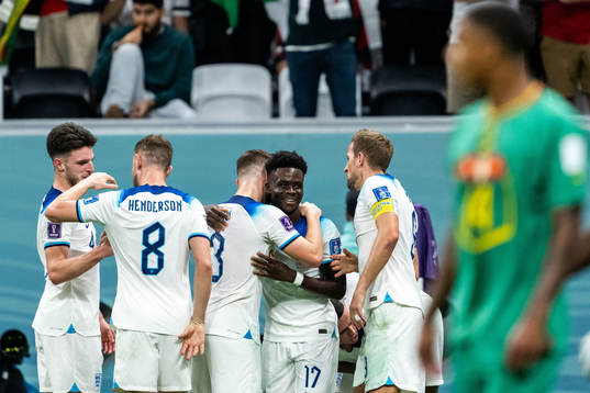 Bukayo Saka of England celebrates scoring 3-0 with teammates