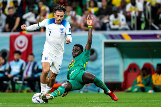 Jack Grealish of England and Bamba Dieng of Senegal