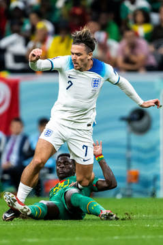Jack Grealish of England and Bamba Dieng of Senegal