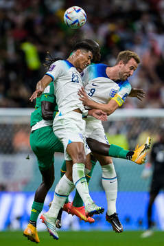 Jude Bellingham and Harry Kane of England in action against