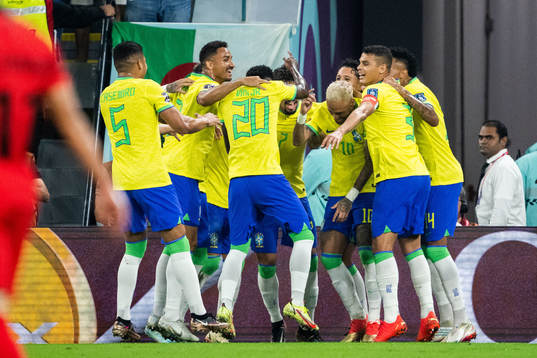 Neymar of Brazil celebrates with teammates