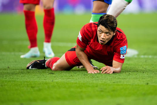 Heechan Hwang of South Korea looks dejected