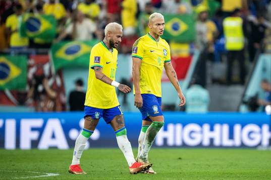 Neymar and Richarlison of Brazil at halftime