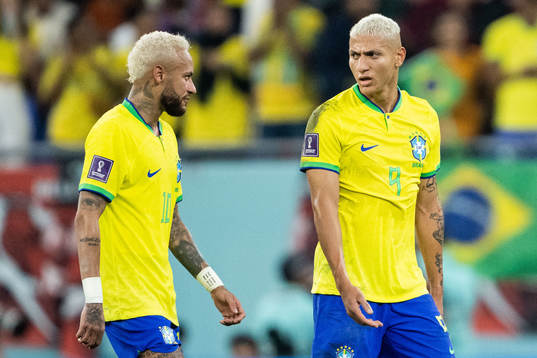 Neymar and Richarlison of Brazil at halftime