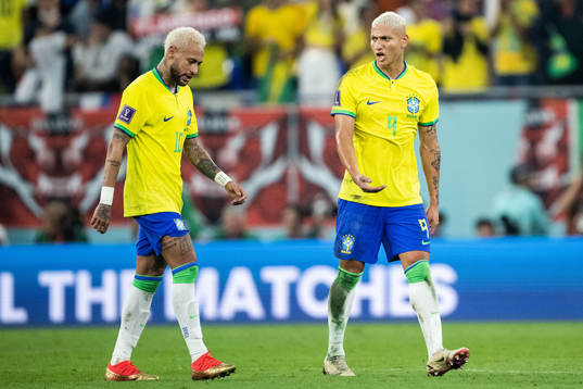 Neymar and Richarlison of Brazil at halftime