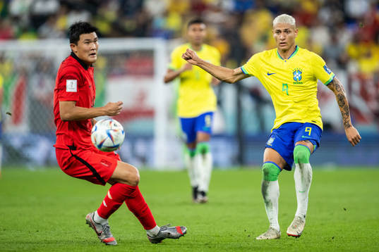 Minjae Kim of South Korea and Richarlison of Brazil
