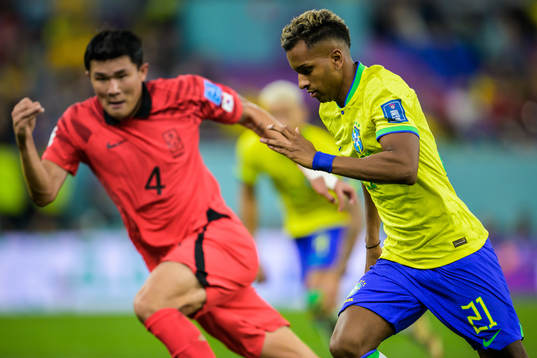 Minjae Kim of South Korea and Rodrygo of Brazil