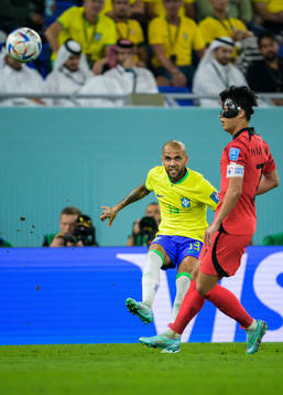 Dani Alves of Brazil and Heungmin Son of South Korea