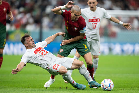 Xherdan Shaqiri of Switzerland and Pepe of Portugal