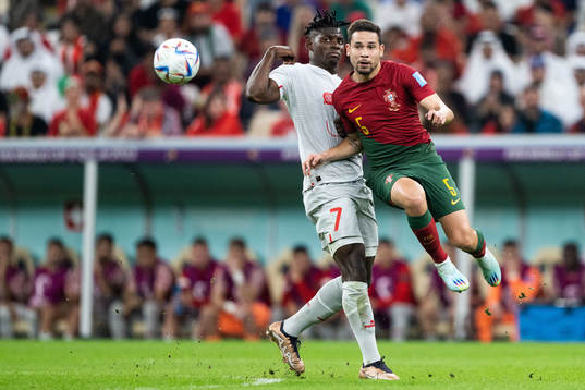 Breel Embolo of Switzerland and Raphael Guerreiro of