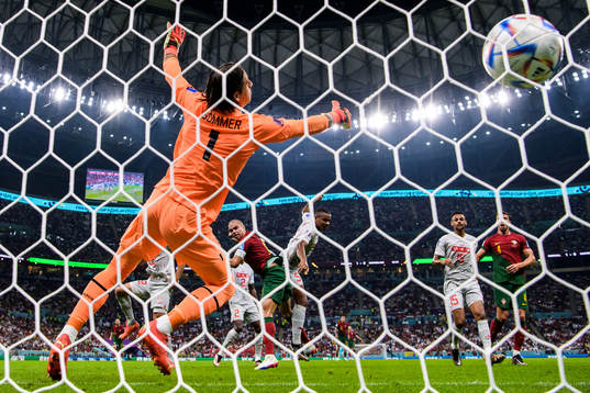 Pepe of Portugal scores the 2-0 goal behind goalkeeper Yann