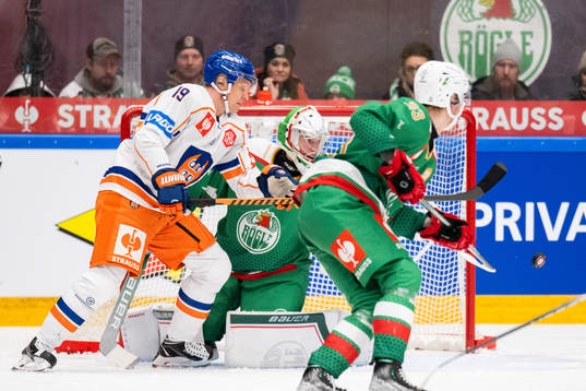 Veli Matti Savinainen of Tappara and goalkeeper Calle Clang