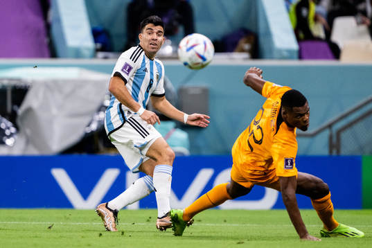 Marcos Acuna of Argentina and Denzel Dumfries of Netherlands