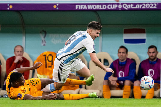 Denzel Dumfries of Netherlands and Julian Alvarez of