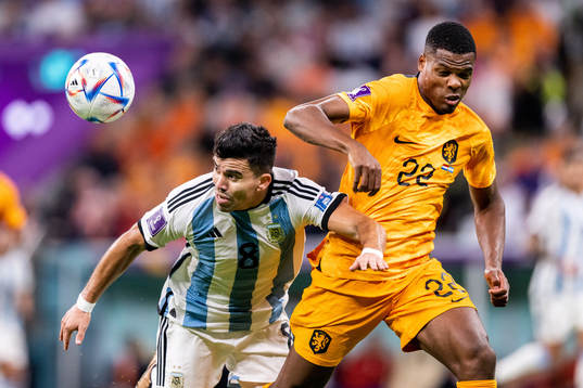 Marcos Acuna of Argentina and Denzel Dumfries of Netherlands