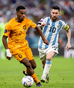 Jurrien Timber of Netherlands and Lionel Messi of Argentina