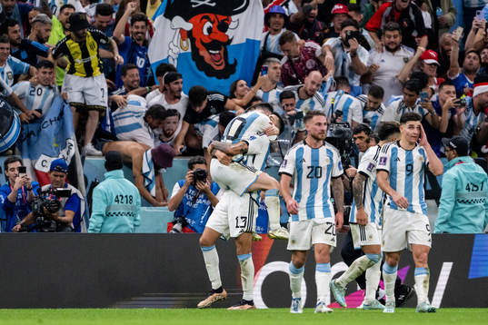 Lionel Messi of Argentina celebrate with Cristian Romero