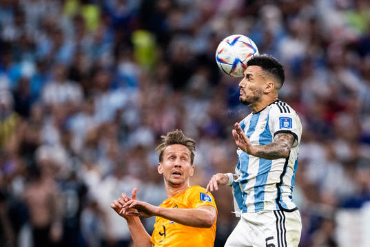 Luuk de Jong of Netherlands and Leandro Paredes of Argentina