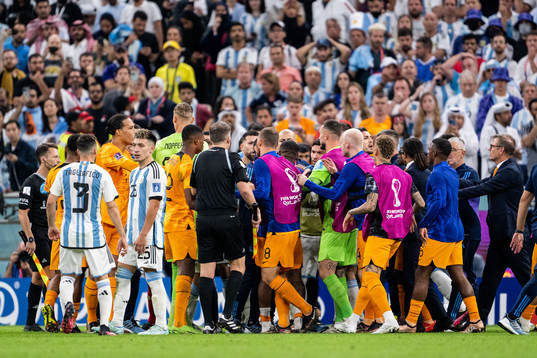 Players of Netherlands and Argentina clash