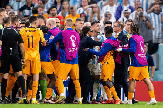 Players of Netherlands and Argentina clash