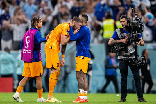 Wout Weghorst and Memphis Depay of Netherlands looks