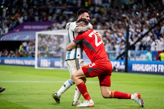Lionel Messi and goalkeeper Emiliano Martinez of Argentina