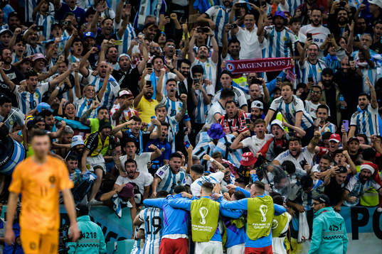Players of Argentina celebrate the 0-2 goal by Lionel Messi