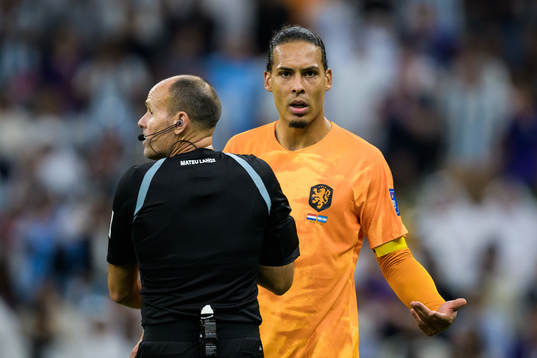 Referee Antonio Mateu Lahoz and Virgil van Dijk of