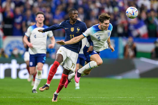 Ousmane Dembele of France and John Stones of England
