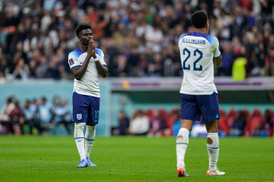 Bukayo Saka and Jude Bellingham of England look dejected