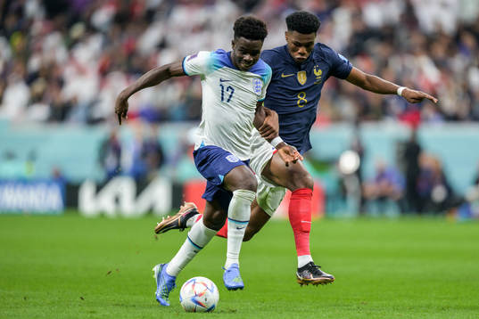 Bukayo Saka of England and Aurelien Tchouameni of France
