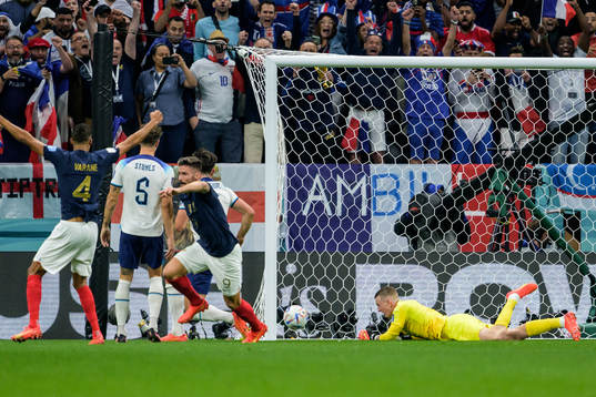 goalkeeper Jordan Pickford of England looks dejected as