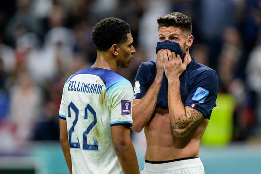 Jude Bellingham of England and Olivier Giroud of France