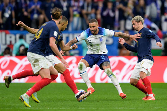 Kyle Walker of England and Antoine Griezmann of France