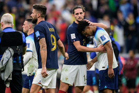 Olivier Giroud and Adrien Rabiot of France with Jude