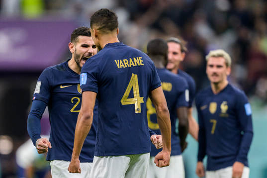Theo Hernandez and Raphael Varane of France celebrate