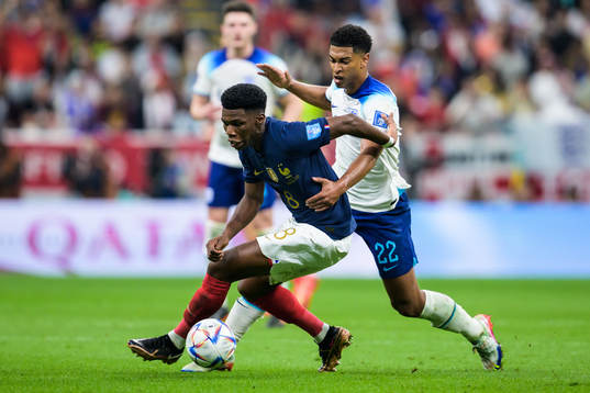 Aurelien Tchouameni of France and Jude Bellingham of England