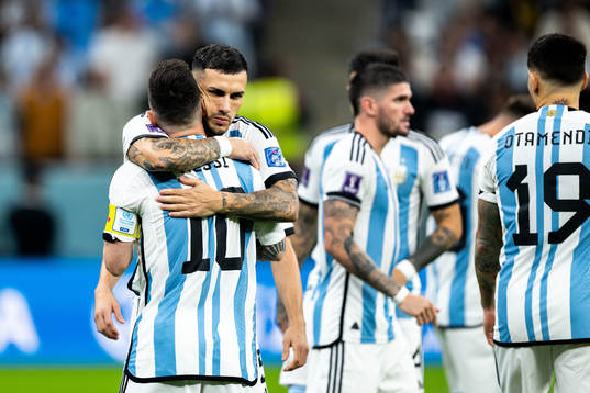 Leandro Paredes and Lionel Messi of Argentina