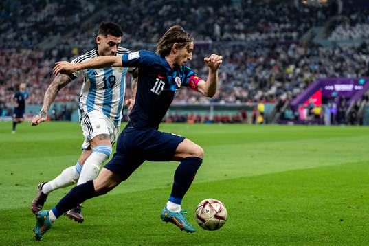 Nicolas Otamendi of Argentina and Luka Modric of Croatia