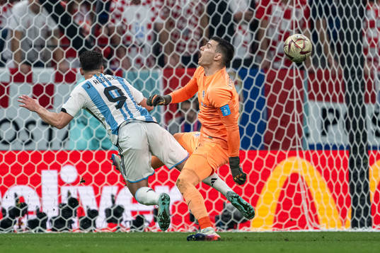 Julian Alvarez of Argentina and goalkeeper Dominik