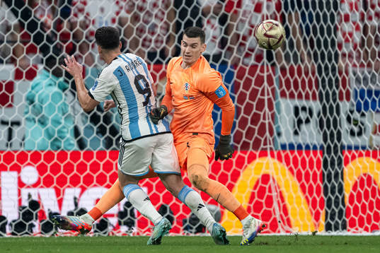 Julian Alvarez of Argentina and goalkeeper Dominik