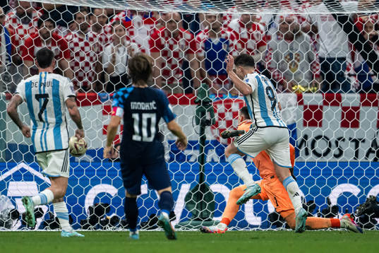 Julian Alvarez of Argentina scores the 2-0 goal behind