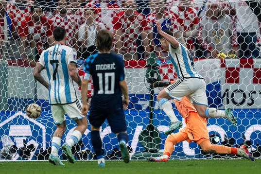 Julian Alvarez of Argentina scores the 2-0 goal behind